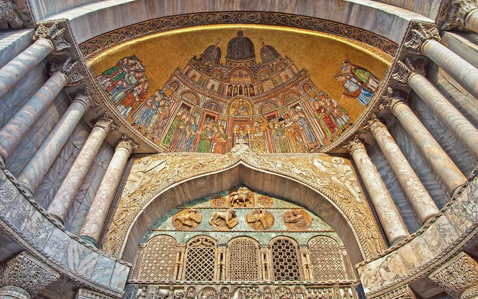 Gold mosaics and marble columns inside St Mark’s Basilica